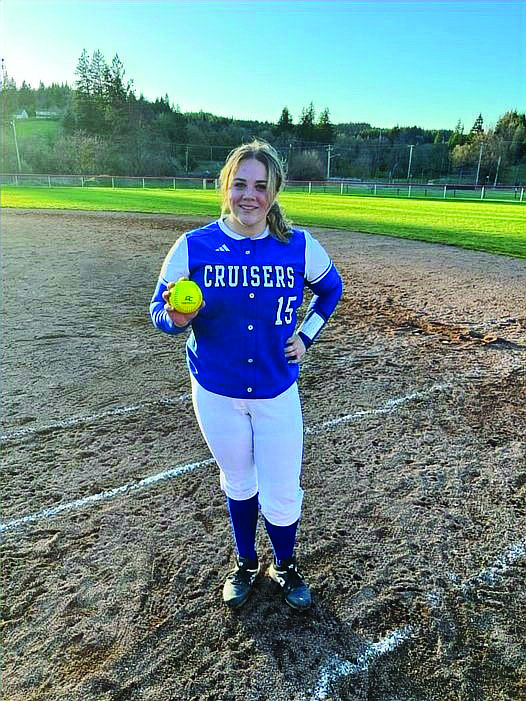 Eatonville's Sara Smith proudly displays the home run ball she hit against Tenino. It was her second grand slam of the season.