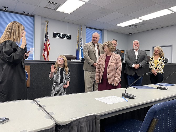 Charlee Dobson, 8, sworn in as junior mayor by District Court Judge Kristin Luis with the Board of Supervisors at their Thursday meeting.