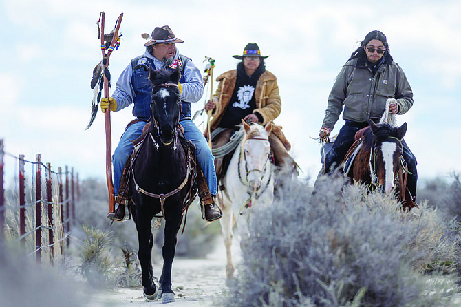 From left, Josh Dini, Rusty Brady and Gary McKinney ride along a fence line to Sentinel Rock overlooking Lithium Americas’ Thacker Pass Project. Dini is a member of the Walker River Paiute Tribe, McKinney is a member of the Duck Valley Shoshone Paiute Tribes of Idaho and Nevada and Brady is a Yomba Shoshone Tribe member.