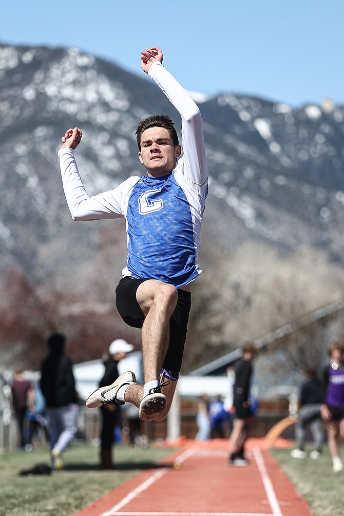 Carson High junior Aaron Witt takes flight in the long jump at the Big George Invitational on Saturday in Minden.