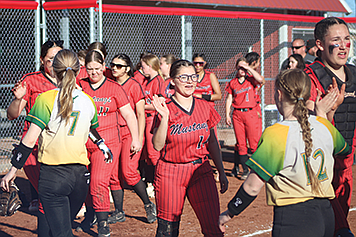 The Mustang softball team congratulates their Battle Mountain guests on a well-played game.