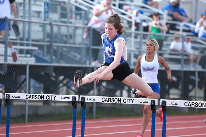 Carson High senior Kaylynn Bloomfield clears the final hurdle during the 300-meter hurdle competition Wednesday. Bloomfield finished in 50.39 and holds the second quickest 300-meter hurdle time in the Class 5A North.