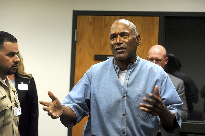 Former NFL star O.J. Simpson reacts after learning he was granted parole at the Lovelock Correctional Center on July 20, 2017.