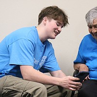 CHS students bring more than tech support to senior center