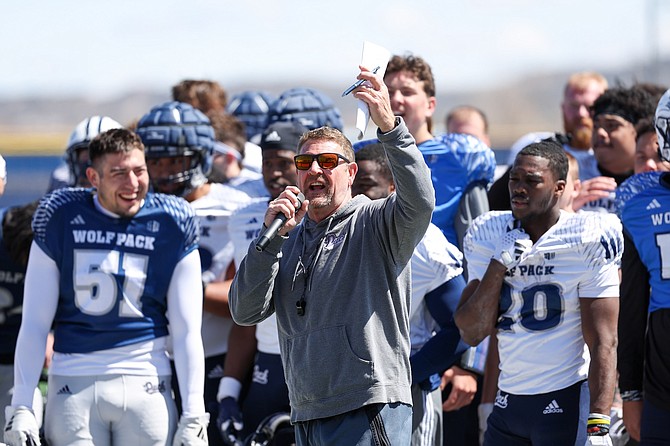Nevada head coach Jeff Choate speaks to fans at the Wolf Pack’s open practice at Carson High School on April 6.