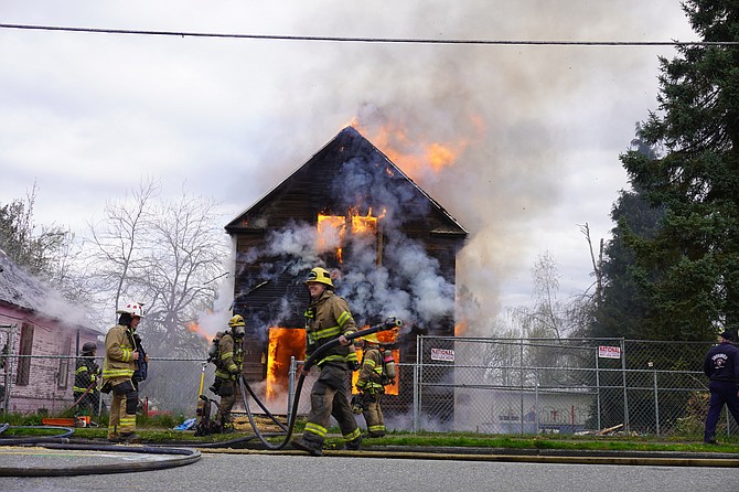 Fire crews conduct a final burn-down of 317 Pine Ave. on April 9, 2024.