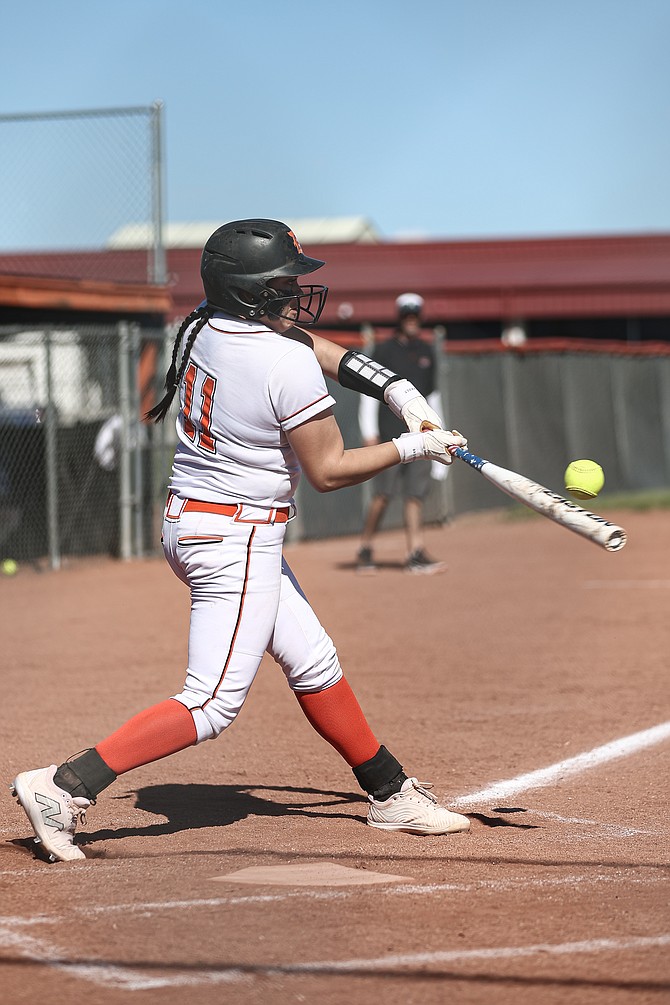 Zora Simpson turns on a pitch against McQueen last week. Simpson is hitting .339 this spring with five home runs and 16 RBIs.