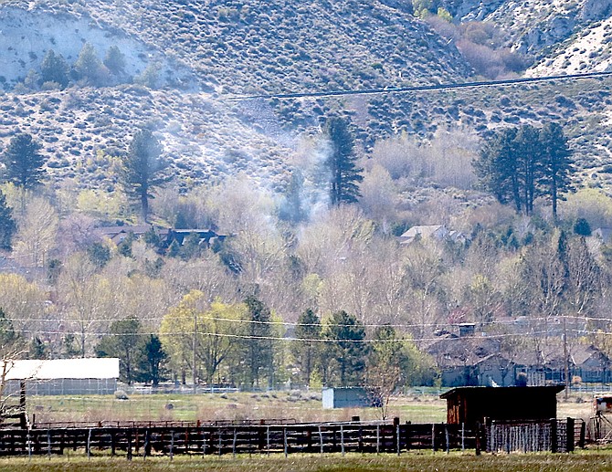 A diminishing smoke plume rises toward Kingsbury Grade on Thursday afternoon from a formerly controlled burn that caught the wind.