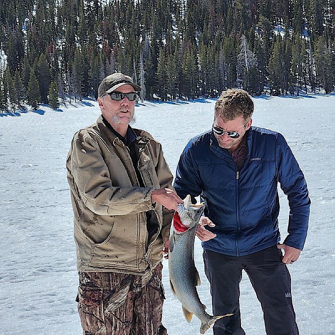 Doug Busey and John Bartell ice fishing on Caples Lake.
