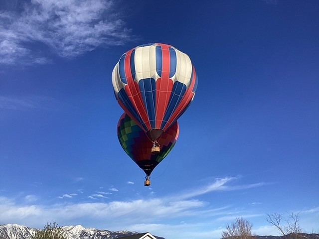 Balloons drift over Gardnerville on Saturday, perhaps passing the traffic on Highway 395, in this photo submitted by Jeff Keenan.