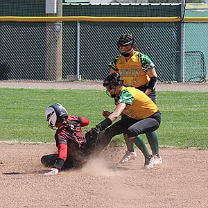 Battle Mountain's Gali Benavidez tags out a Pershing County runner during Thursday's games in Battle Mountain.