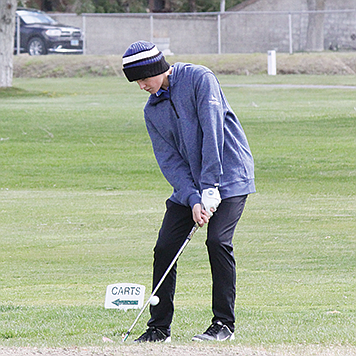 Lowry’s Maddex Hislop chips on to the third green at Winnemucca Municipal Golf Course during a Northern 3A tournament on April 15.