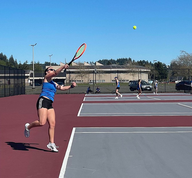 Eatonville's Bailey Andersen delivers a serve against Hoquiam. Andersen would go on to win her match 6-0, 6-0.