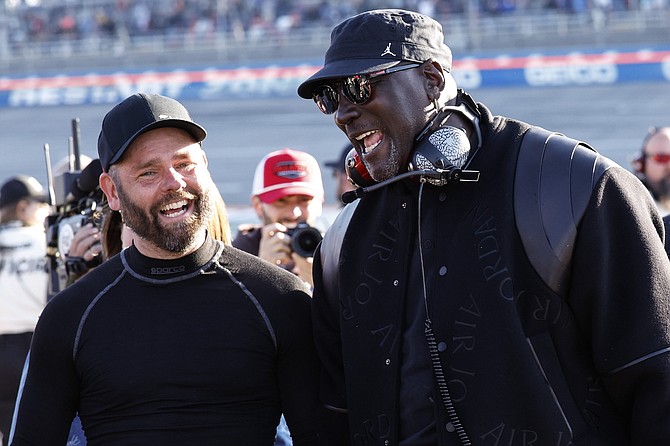 23XI Racing co-owner Michael Jordan celebrates a win by driver Tyler Reddick after a NASCAR Cup race at Talladega Superspeedway on Sunday.
