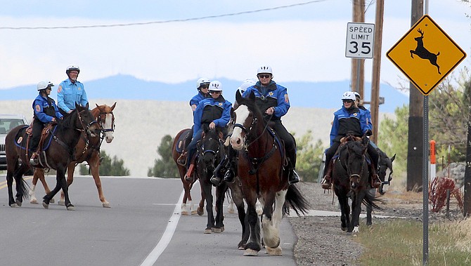 The Douglas County Sheriff's Mounted Posse rides along Jacks Valley Road north of Genoa on Thursday. The posse is scheduled to participate in Saturday's horse parade.