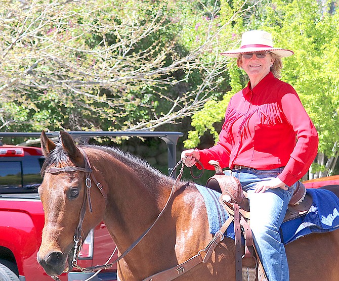 Ranch No. 1's Lisa Lekumberry rides in the Western Heritage Days Parade on Saturday. The rest of the Trimmer clan, making up the grand marshals, was further up on what might be the first actual float in the parade's brief history.
