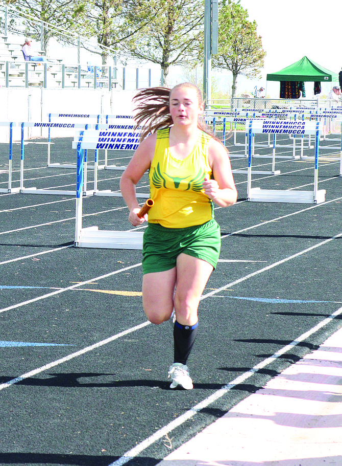 Battle Mountain's Tessa Ostler runs a leg of the 4x400 relay.