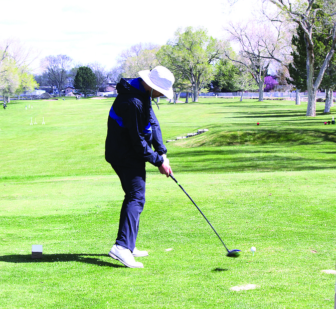 Lowry’s Landon Esquivel hits his drive on the fourth hole at Winnemucca Municipal Golf Course during a Northern 3A tournament on April 15.