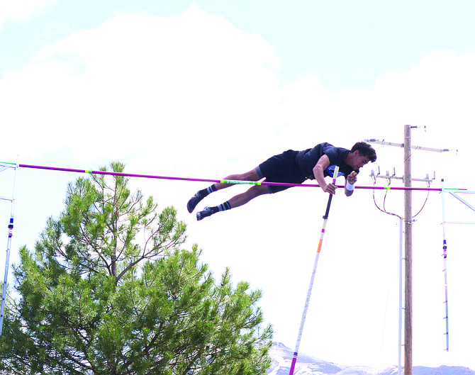 Lowry's Brent Kension sets a new school record in the pole vault as he clears the bar at the Don and Lynda Walton Invitational in Winnemucca.