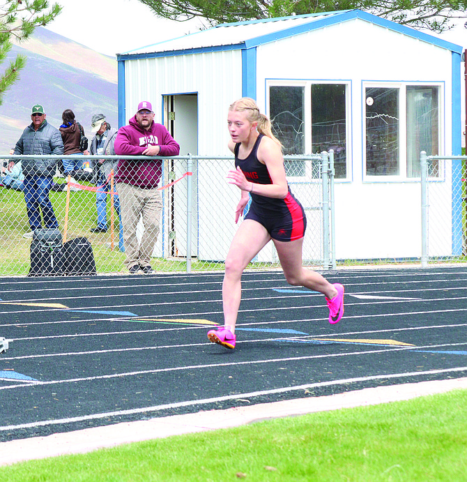 Pershing County's Khole Montes runs the 400 meters at the Don and Lynda Walton Invitational at Lowry High School on Saturday.