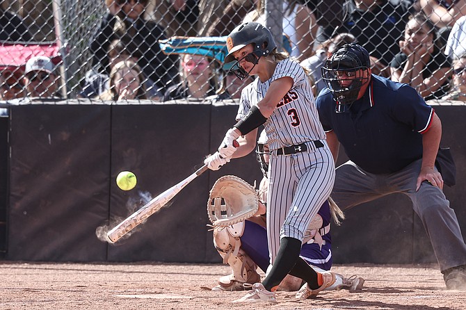 Douglas High junior Annie Hill connects with a double in the fifth inning of the Tigers’ 6-0 win over Spanish Springs Thursday. Douglas secured the No. 1 seed in next week’s Class 5A North regional tournament with the victory.