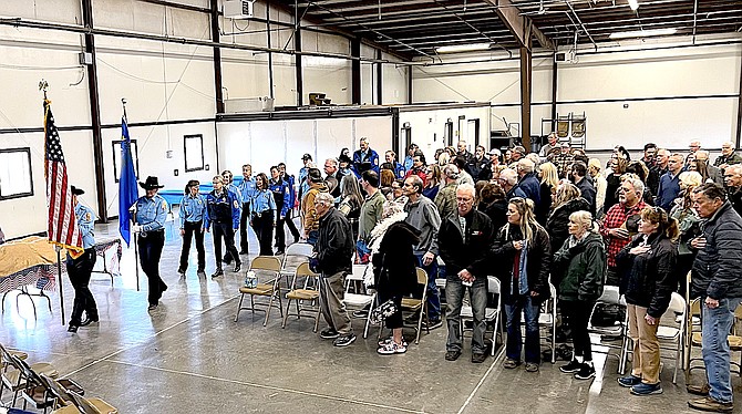 The Douglas County Sheriff's Mounted Posse brings in the colors for the Quilts of Valor presentation at the Douglas County Fairgrounds on Sunday.