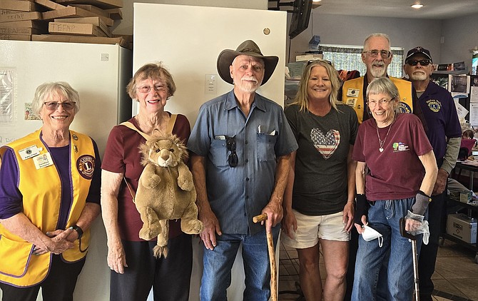 Members of the Dayton Valley Lions Club, front row, from left, Kathy O'Neill, Sharon Glashon, George Marston, Traci Rothman and Cheryl Frair, and back row, left, Cal Bushek and Ray Hudson, donated a replacement freezer to assist the Healthy Communities Coalition with its food storage needs.