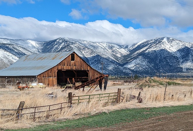 Cynthia Miles captures this photo of a barn and the Carson Range on Monday morning.