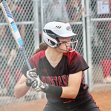 Pershing County’s Raegan Burrows steps up to bat for the Mustangs against Silver Stage on Saturday in Lovelock.