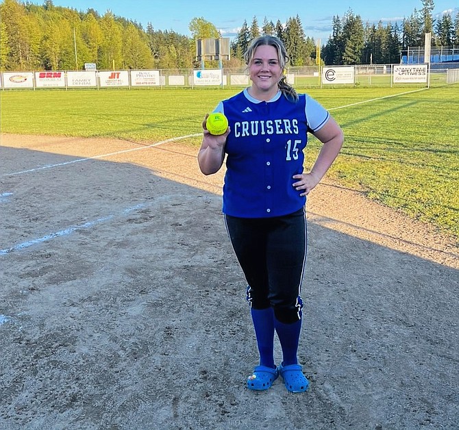 Eatonville's Sara Smith shows off the home run ball she hit against Elma.