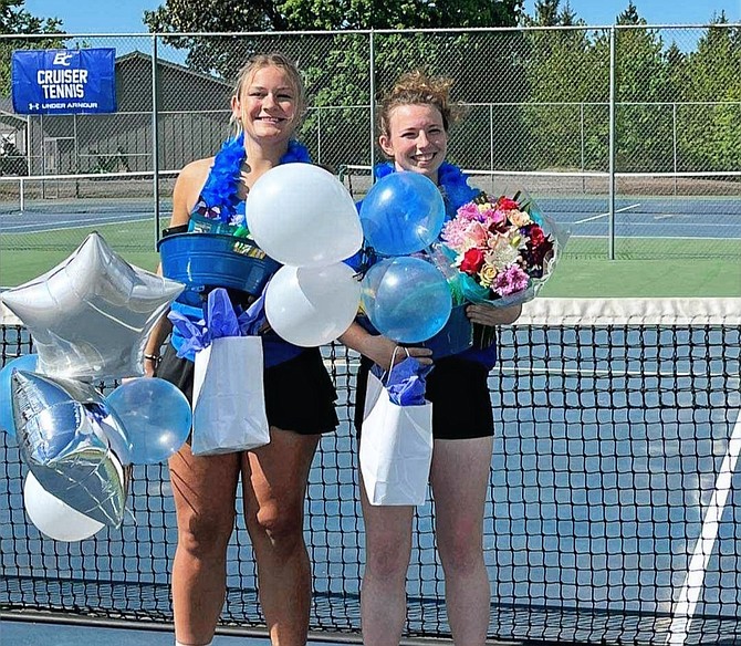 Eatonville Seniors Ella Gendreau and Tam Thompson pose for a photo after being honored on Senior Night.
