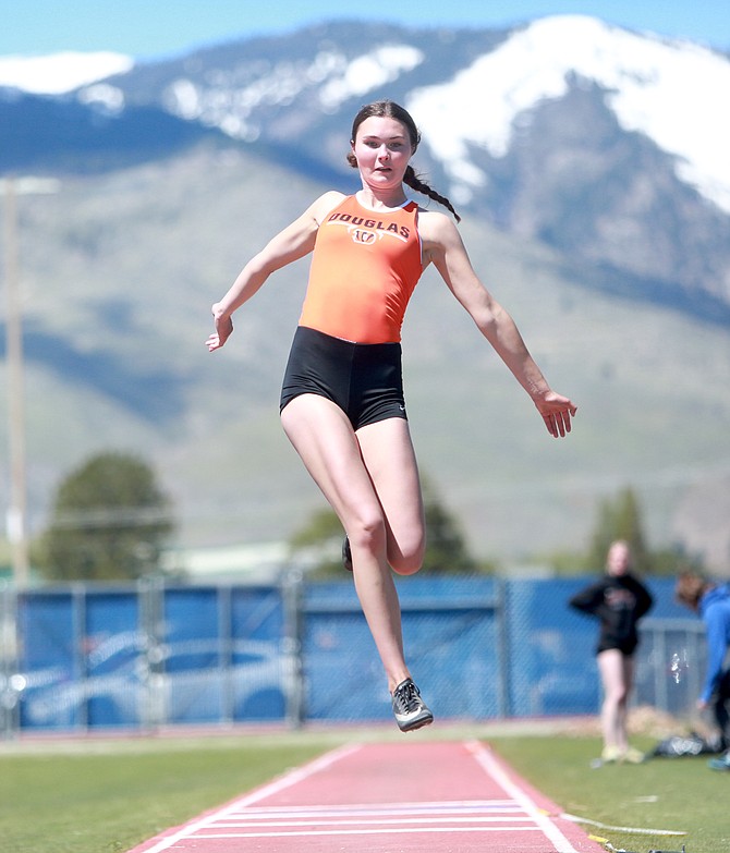 Douglas High's Logan Karwoski leaps, during the long jump at Carson High School in late April. Karwoski is qualified for a maximum of four events for the Northern region championship track and field meet Friday and Saturday at Carson High School.