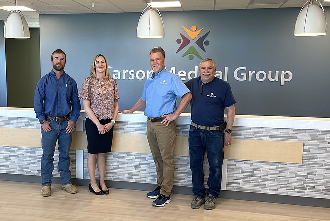 From left, Pat Beauchamp of SB Builders, Carson Medical Group CEO Becky Hepler, Mark Beauchamp of SB Builders, and construction superintendent Dennis Martin in the lobby of the new Carson Medical Group facility off Old Hot Springs Road on May 10.