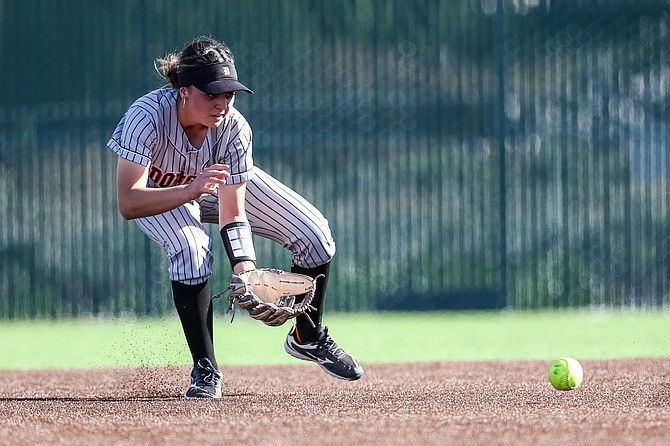 Douglas High senior Mercedes Covey fields a grounder at second base, during the Class 5A North regional semifinal. The Tigers beat Spanish Springs, 10-0, in five innings to punch their ticket to their third consecutive state tournament.
