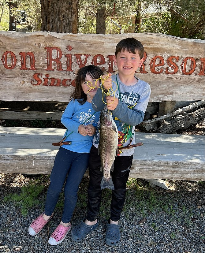 Orangevale, Calif., residents Bradley and Chloe Brubaker with a 17-inch, 2.5-pound rainbow trout they caught in the East Fork of the Carson River.