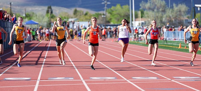 Douglas High sophomore Grace Strabala, middle, leads the pack during the Class 5A girls 100-meter dash at the regional track and field meet this past weekend at Carson High. Strabala broke the school record in the event, posting a 12.21.