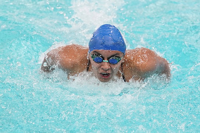 Carson High’s Alexandra Llamas-Cruz competes in the 100-yard butterfly at the Class 5A North regional swim meet. Llamas-Cruz won the regional title in the event and qualified for state in four events.