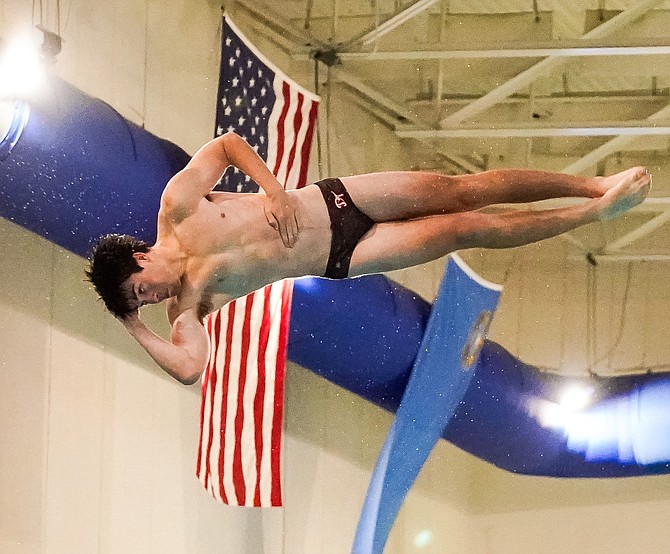 Douglas High's Allen Baker spins in the air during the Class 5A North regional dive meet Wednesday. Baker and two other Tiger divers punched their tickets to the state meet.