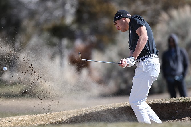 Douglas High’s Reese Torres chips out of a bunker earlier this season. Torres qualified for the 2024 Class 5A state golf tournament this week after tying for 12th at the regional tournament.