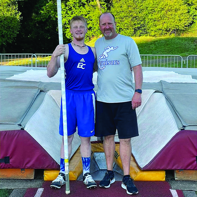 Eatonville’s Ethan Carter stands with Coach Olson following his league championship clinching and school record-breaking vault of 14’2" at the 1A Evergreen League Championships.