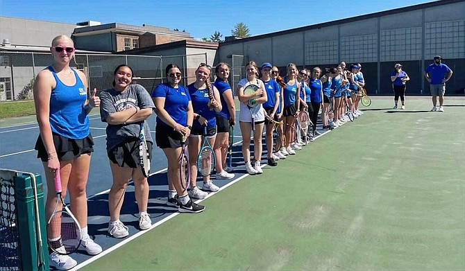 The Lady Cruiser tennis team posses for a photo prior to their match last week.