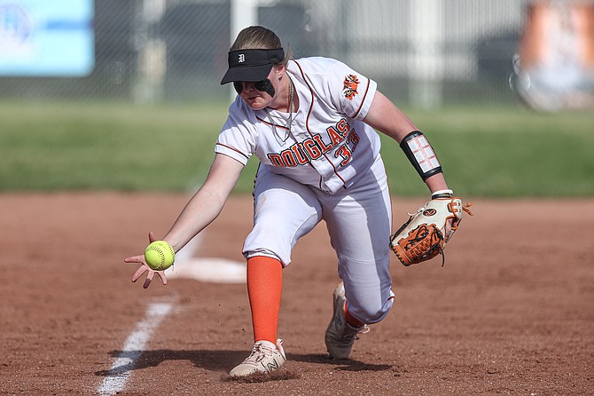 Douglas High senior Shasta Lumsden makes a barehanded play at third base, during a regular season game earlier this spring. The Tiger softball team fell in the opening round of the Class 5A state tournament to Coronado, 8-3.
