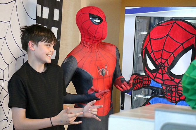 Tyler Baker, 15, a Carson High School student, poses with Spider-Man on May 11 at the Carson City School District’s Career and Technical Education Teaching and Training Early Childhood Education’s Day of the Child.