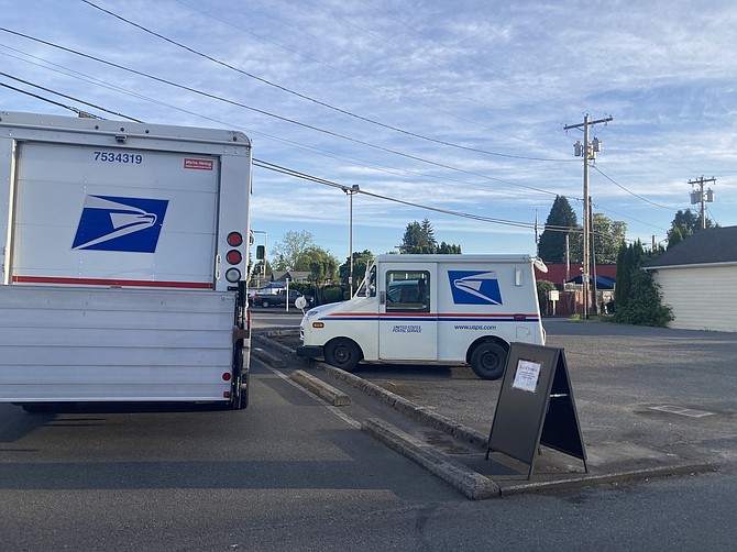 The location where the drive-up mailbox at the Monroe Post Office usually is currently awaits a replacement mailbox.