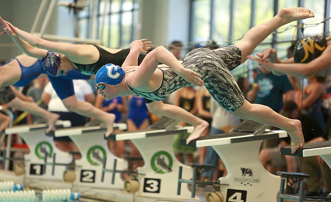 Carson High’s Alexandra Nerska jumps off the platform, during the Class 5A North regional swim meet. Nerska finished her junior season with several medals from the 2024 state swimming meet in Las Vegas this past weekend.