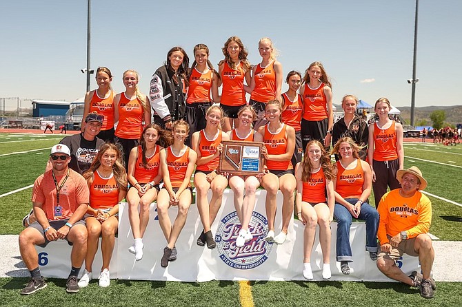 The Douglas High School girls track and field team poses with the Class 5A North regional championship trophy Friday prior to the beginning of the state meet at Carson High School.
