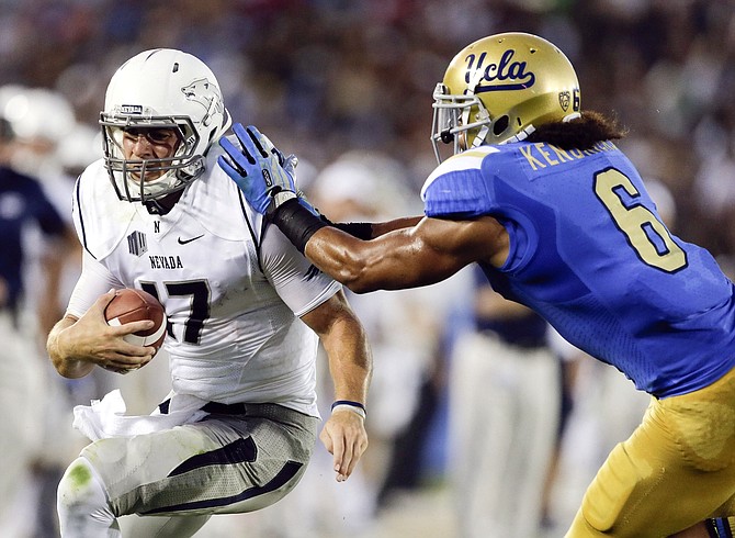 Nevada quarterback Cody Fajardo and his Wolf Pack teammates were pummeled at UCLA in an August opener in 2013.