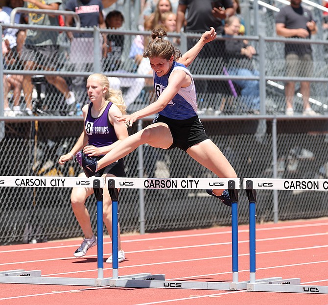 Carson High’s Kaylynn Bloomfield leaps over one of the final hurdles of the 300-meter hurdles during the Class 5A state track and field meet at Carson High. Bloomfield was the quickest runner from the North in the event, taking fifth in 46.64 seconds.