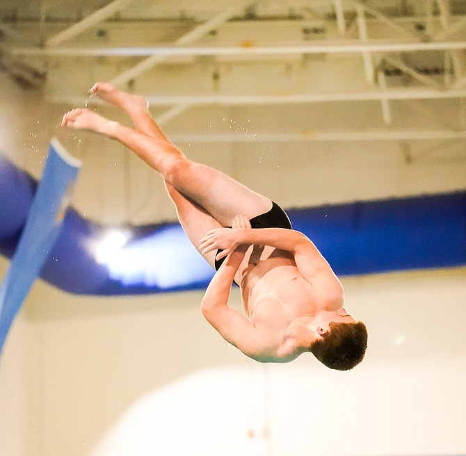 Douglas High’s Kolten Brown spins through the air, during the 1-meter dive event at the Class 5A regional diving meet. Brown went on to take third place at the Class 5A state diving meet this past weekend in Las Vegas.