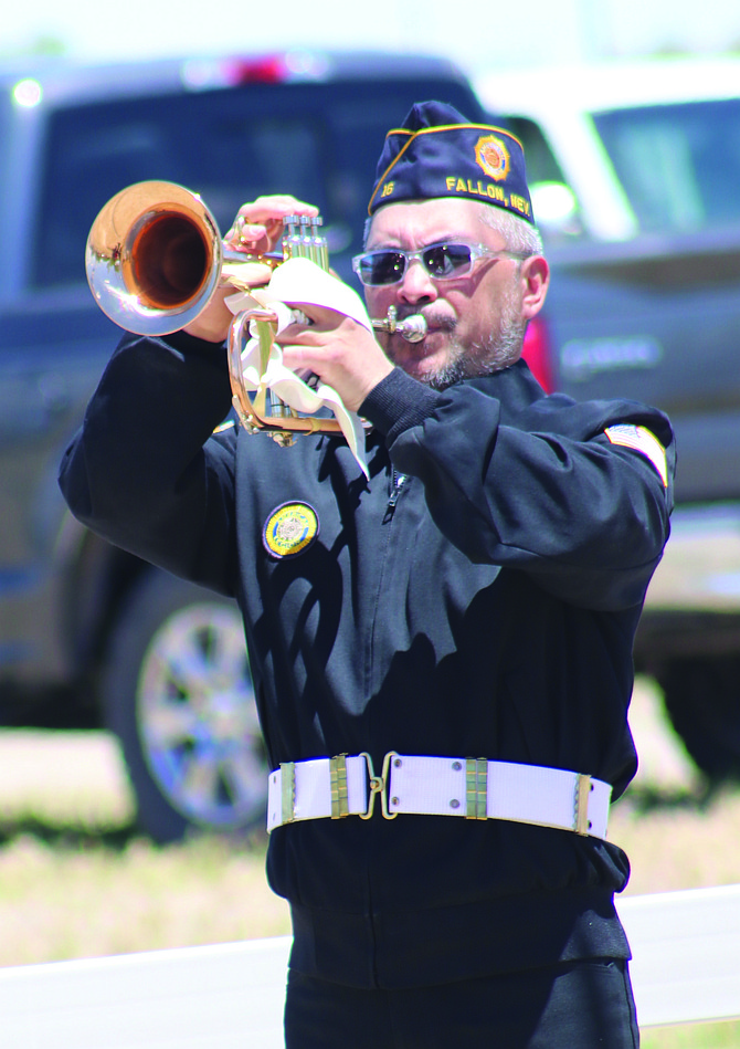 A bugler plays taps at a past Memorial Day service.